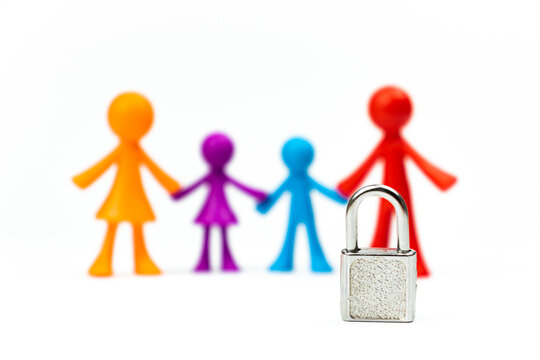 Young family with lock. Ban on children or adoption concept. Isolated on a white background photo