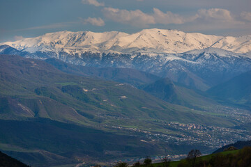 Beautiful view of the outskirts of Ijevan with snowy mountains and forest, Armenia