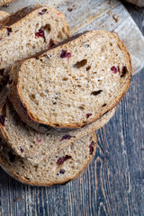 fresh cut bread made of flour and dried cranberries