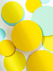 Simple round shapes background in pastel blue and yellow colours. Fun bright colored mosaic of...