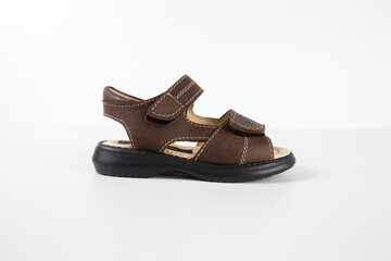 Male brown sandal on white background, isolated product, top view studio.