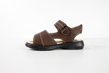 Male brown sandal on white background, isolated product, top view studio.