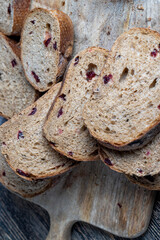 fresh cut bread made of flour and dried cranberries
