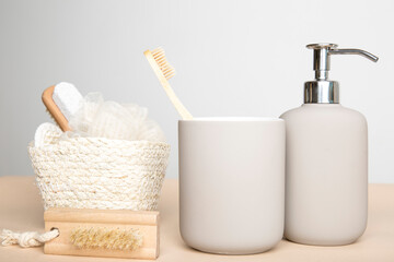 wooden eco-friendly toothbrush with cup, bathroom soap dispenser, washcloth and shower brush