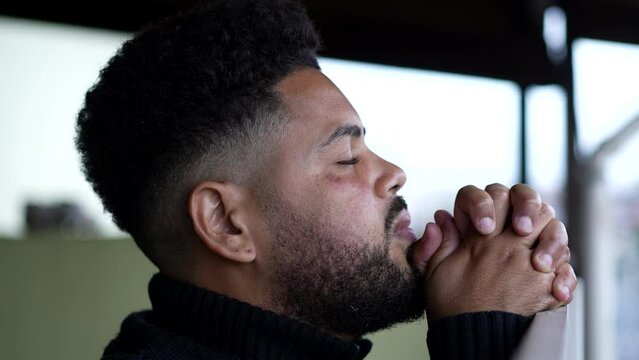A young man praying to GOD having HOPE