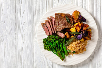 Steak with broccoli and potatoes, copy space