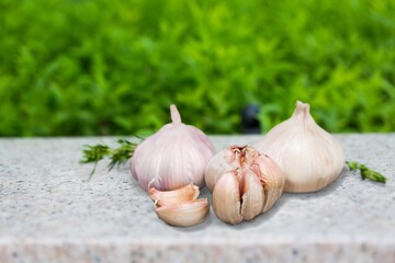 Aroma peeled garlic cloves on wooden desk