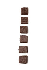 Dark chocolate candies isolated on white background.