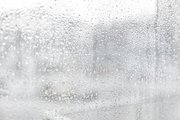 Fototapeta na wymiar Closeup view of window with rain drops