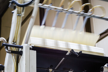 Printing house. Printing equipment. Machine for varnishing printed products. Processing after...