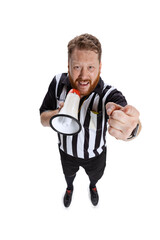 One young bearded man, soccer or football referee shouting at megaphone isolated on white studio...