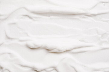 Soft foam soap or facial cleanser product or shaving cream texture background copy space.