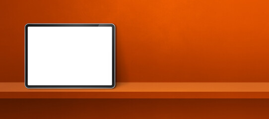 Digital tablet pc on orange wall shelf. Background banner