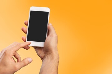 Fototapeta na wymiar Human hand using smartphone with a blank screen