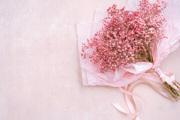 Pink Gypsophila flowers in paper wrapping