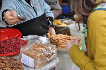 Woman buying spices at market
