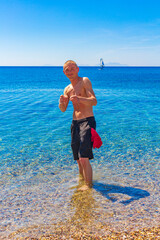 Young traveler hiker with natural coastal landscapes on Kos Greece.