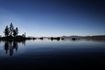 a tranquil view of Lake Tahoe at sunset