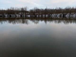 Dark water of the river in winter.