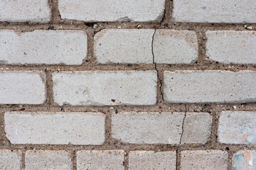 cracked white brick wall close up