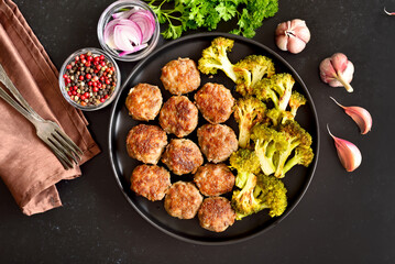 Homemade cutlets and fried broccoli