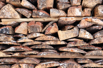 stack of firewood made from old planks close up view