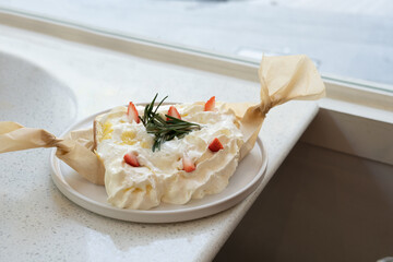 bread or toast topped with whipped cream and fresh strawberry at cafe