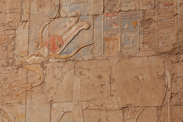 Hathor, nursing Cow Goddess - ancient relief of Hatshepsut Mortuary temple at Deir el-Bahari near Luxor, Egypt. For the Egyptians, cows symbolized loving care, nourishment and fertility
