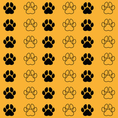 Dog or wolf paws pattern black and outline on orange background
