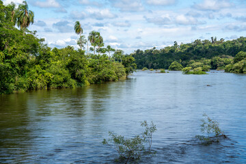 Argentina, wooden bridge crossing the Iguazu River on  a walk path .