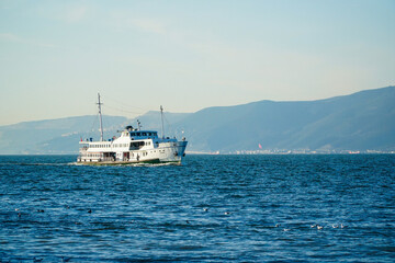 Ferry on the sea. Minimal concept of ferry and the sea. Steamship floating on the sea. Steamship in Istanbul Bosphorus.