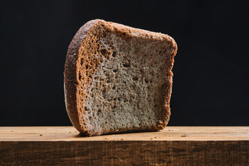 Moldy fungus on food. Fluffy spores mold on a bread. Selective focus