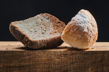 Moldy fungus on food. Fluffy spores mold on a bread. Selective focus