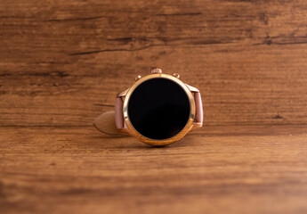 smartwatch on wooden background