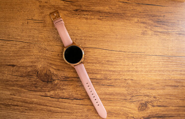 Smartwatch isolated on wooden background