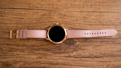 Smartwatch on wooden table