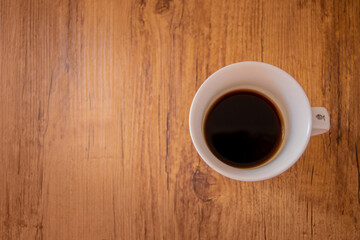 Cup of coffee on a wooden table