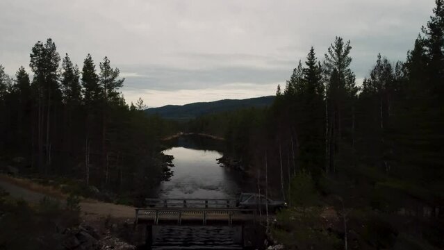 Landrover driving over bridge follow 4K Lake Holkae Holmevatn Norway 30fps