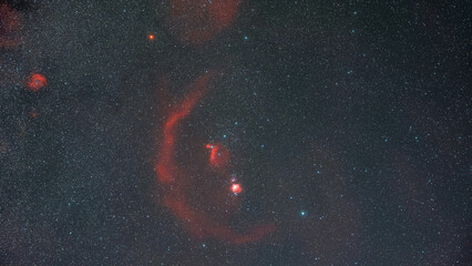 The Orion constellation, the star of Betelgeuse and the nebulas in the night sky full of stars