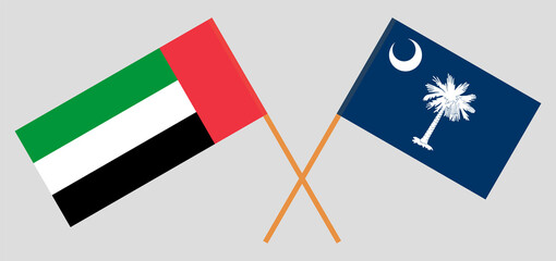 Crossed flags of the United Arab Emirates and The State of South Carolina. Official colors. Correct proportion