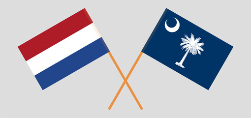Crossed flags of the Netherlands and The State of South Carolina. Official colors. Correct proportion