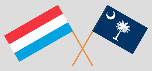 Crossed flags of Luxembourg and The State of South Carolina. Official colors. Correct proportion