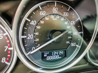 A close-up photo of a car speedometer showing mileage