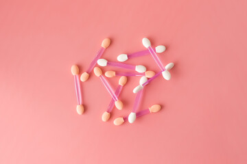 Sponges for applying makeup on a pink background. Empty space for the text.