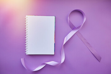 Mock up of notepad and purple ribbon for Purple Day with sunlight. World Epilepsy Day, March of 26....