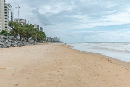 View of the sand strip of the beautiful beach of Boa Viagem in Recife, PE, Brazil. Northeast brazilian beach during morning.