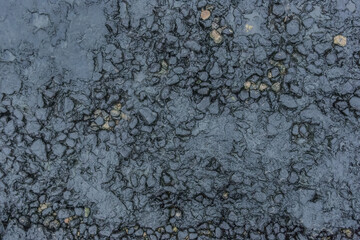 Fuel pollution soil dirt oil blue rough stone surface of the earth toxic industry dark rock background