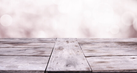 Wooden table against spring background
Massive wooden table against pink spring background. Space...