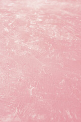 Blurred pink structure surface. Vertical background textur with short depth of field.