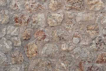 background, texture - rough masonry from wild stone and cement